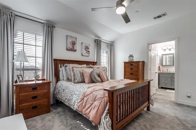 a bedroom with a bed and dresser