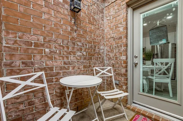 a view of a chair and table in the balcony
