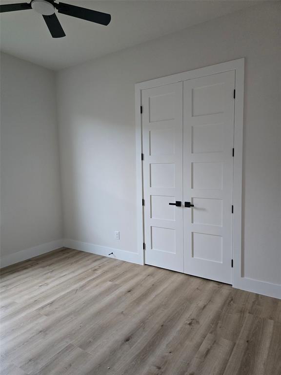 808 N Avenue East Springtown, TX 76082 - Photo 17 of 21 wooden floor in an empty room