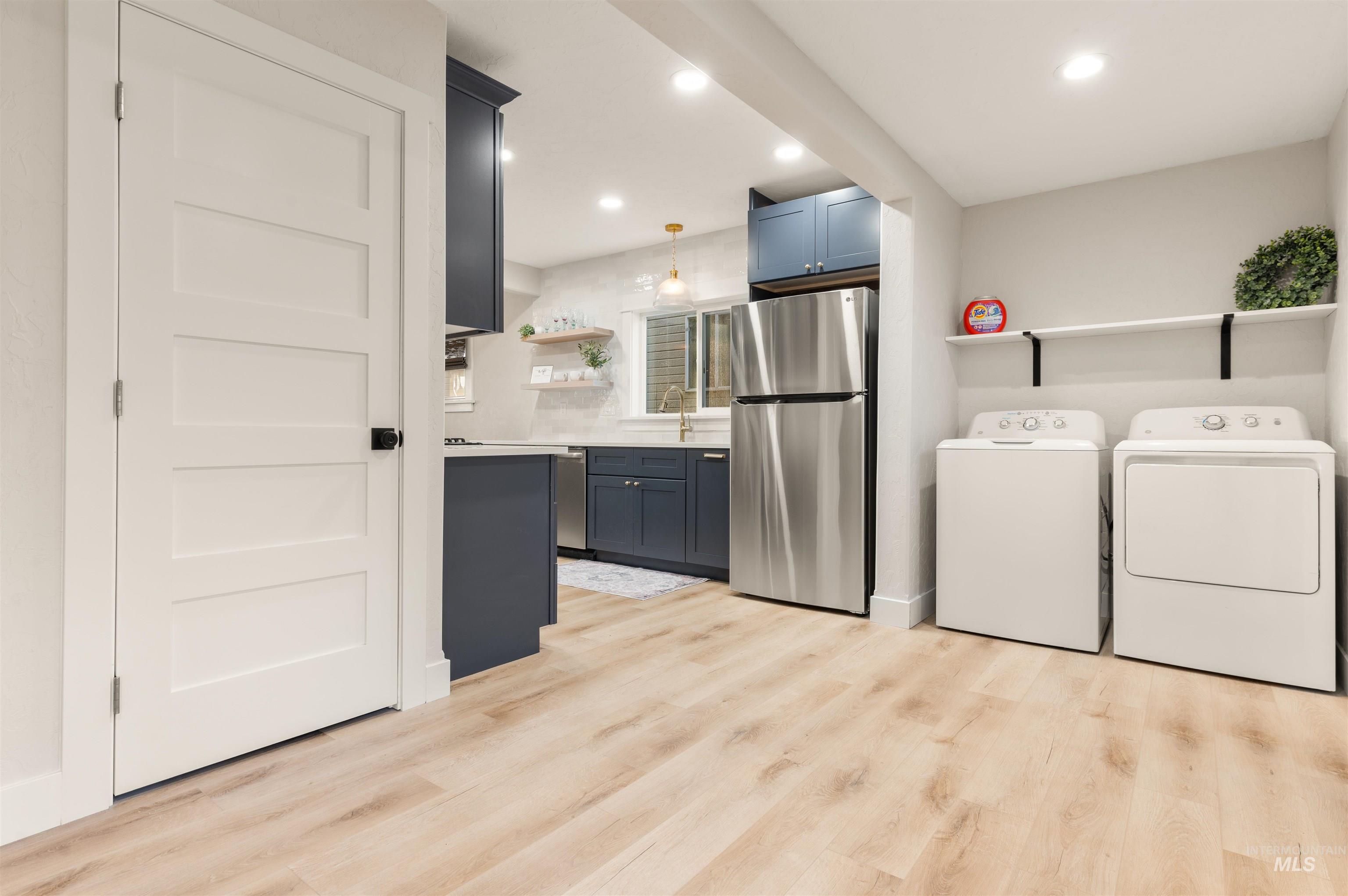 811 Prospect Avenue Lewiston, ID 83501 - Photo 11 of 23 Light wood-finish flooring extends through multiple rooms, complemented by recessed lighting