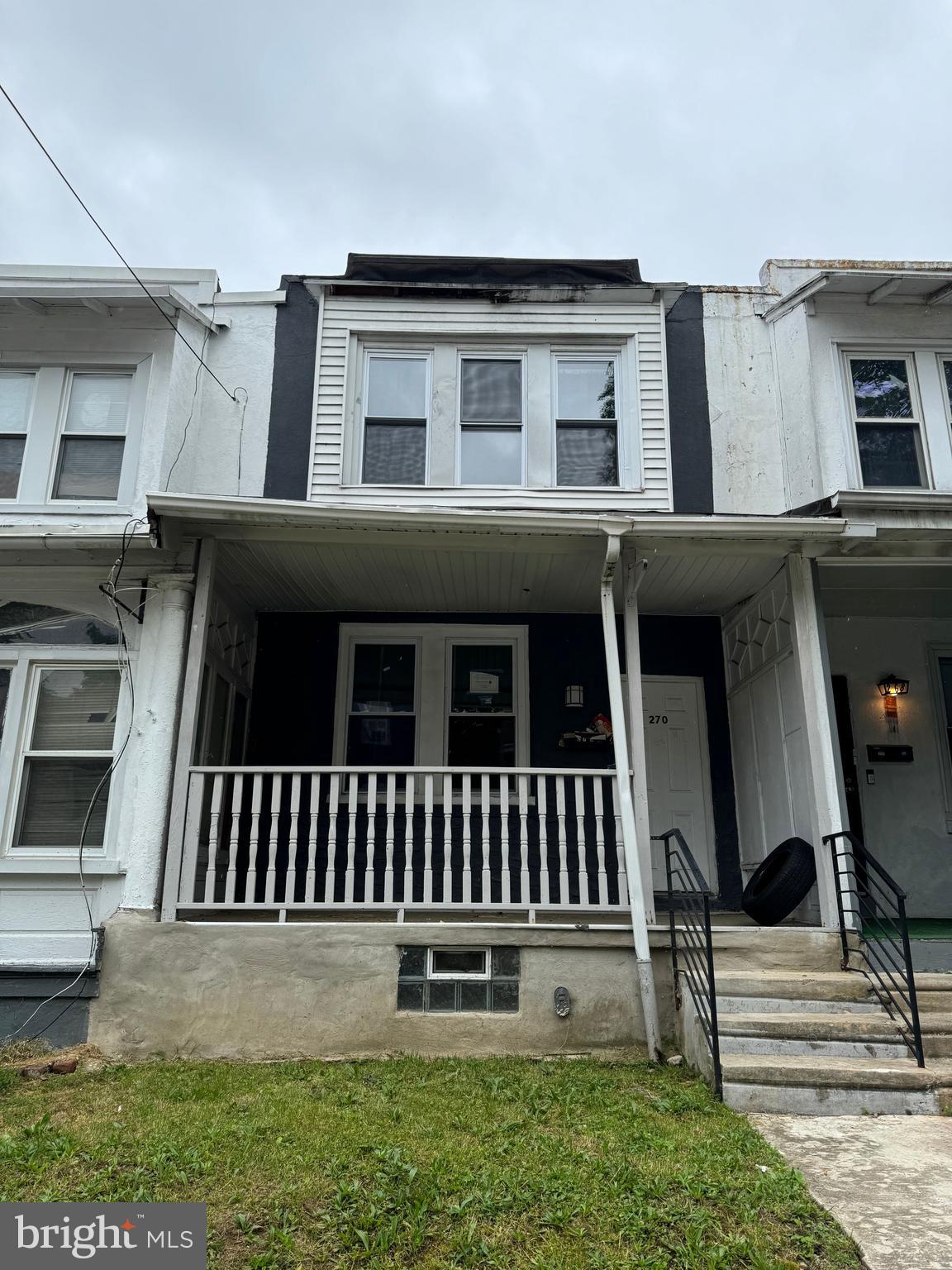 270 East Sharpnack Street Philadelphia, PA 19119 - Photo 1 of 1 a white house that has a small yard and more windows