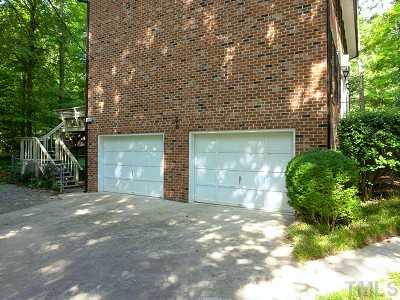 4611 Connell Drive Raleigh, NC 27612 - Photo 12 of 13 a view of a yard with brick wall