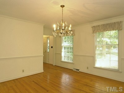 4611 Connell Drive Raleigh, NC 27612 - Photo 4 of 13 a view of a room with a window and chandelier
