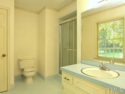 4611 Connell Drive Raleigh, NC 27612 - Photo 8 of 13 a bathroom with a granite countertop sink toilet and shower