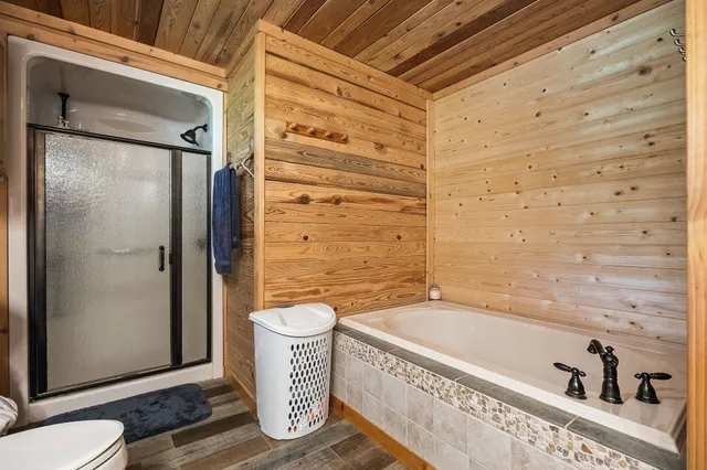 a view of a balcony with wooden floor and stairs