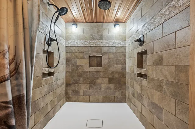a view of entryway with a front door and wooden floor