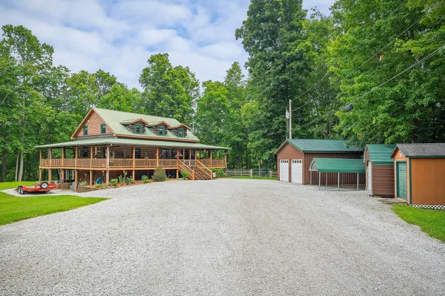 a view of a house with a yard and plants