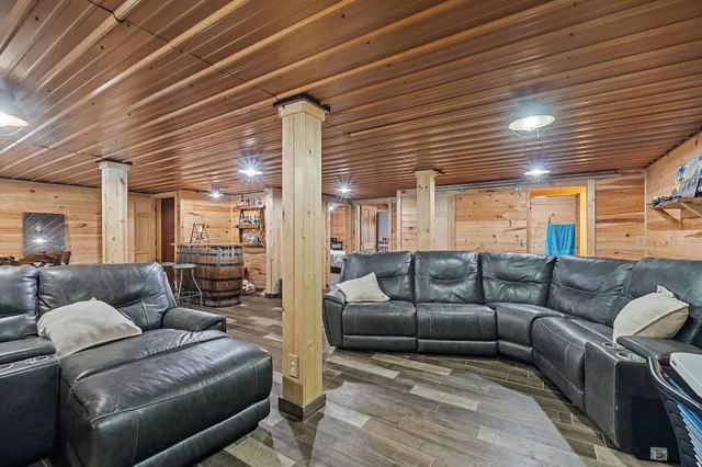 an aerial view of a house with a backyard