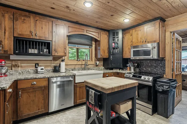 a backyard of a house with lots of green space and mountain view
