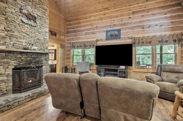 a aerial view of a house with swimming pool garden and patio
