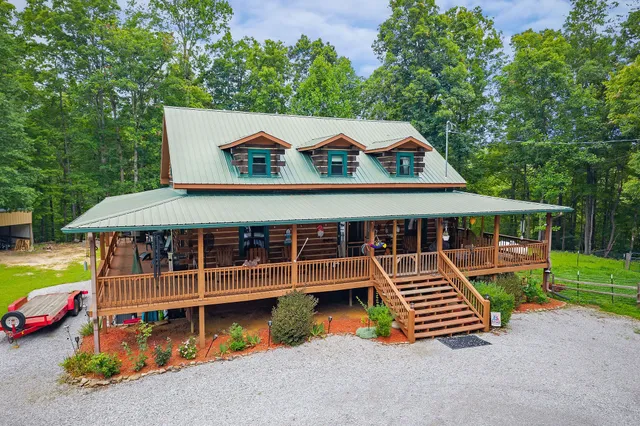 a view of a porch with wooden floor and iron stairs