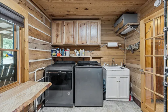 a front view of a house with a yard table and chairs