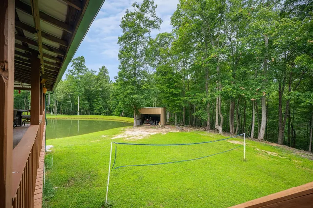 a spacious bathroom with a granite countertop sink mirror and a toilet