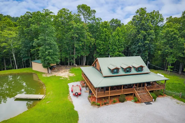 a view of a porch with furniture and floor to ceiling window