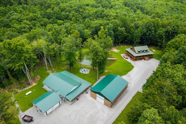 a living room with furniture kitchen view and a flat screen tv
