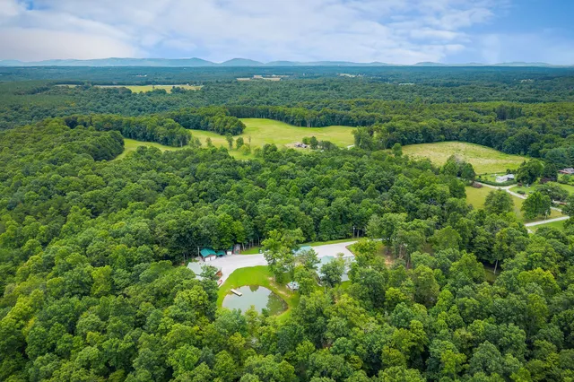 a view of a bathroom with a tub and a view of bathroom