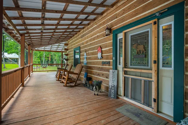 a bedroom with furniture and a large window