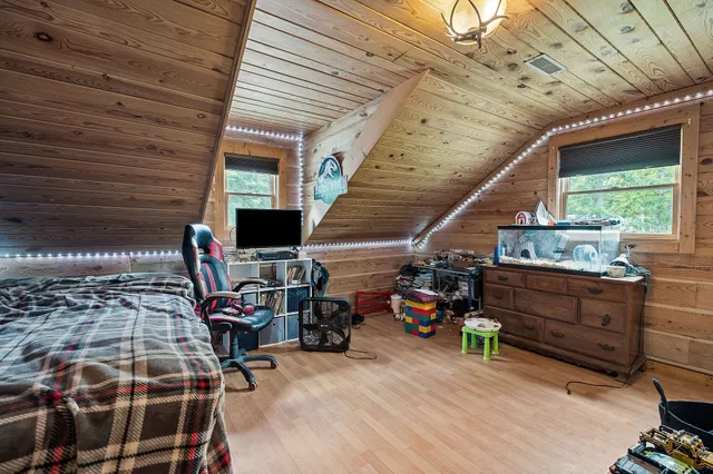 a kitchen with a sink a counter top space appliances and cabinets