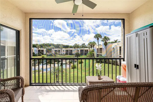 a view of a balcony with furniture