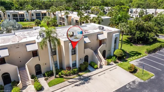 an aerial view of a house with yard swimming pool and outdoor seating