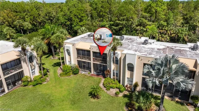 a view of a house with a yard and potted plants