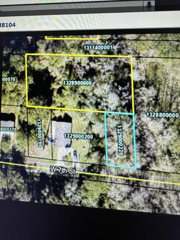 a view of a yard with wooden floor