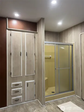 a bathroom with a shower and a sink