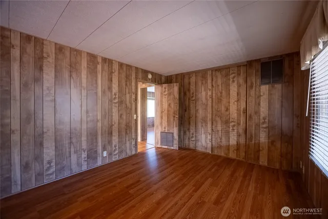 a view of a room with wooden walls