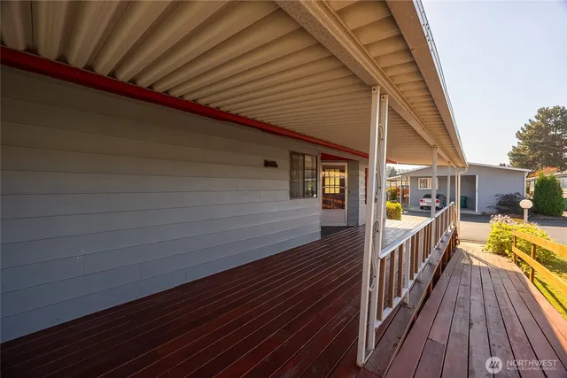 a view of balcony with wooden floor