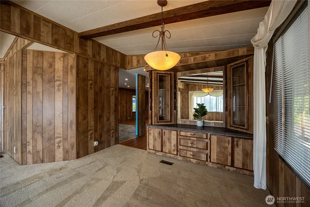 a view of a living room and bathroom
