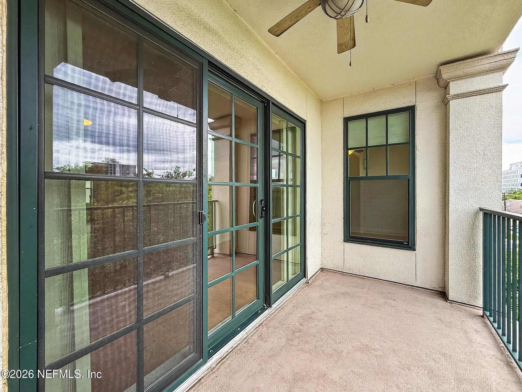 1661 Riverside Avenue, Unit 407 Jacksonville, FL 32204 - Photo 22 of 60 a view of an empty room with a sliding door