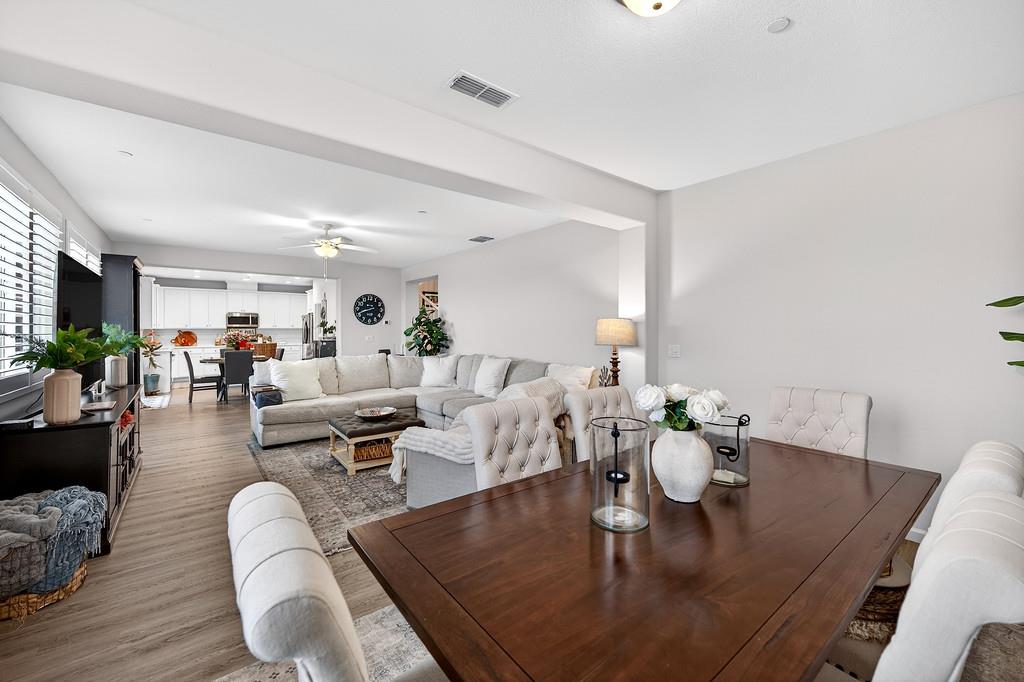 1397 Rio Grande Drive Plumas Lake, CA 95961 - Photo 11 of 54 a living room with furniture couches and a dining table