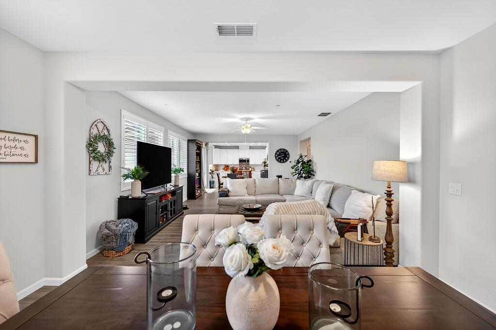 1397 Rio Grande Drive Plumas Lake, CA 95961 - Photo 12 of 54 a living room with furniture a flat screen tv and kitchen view