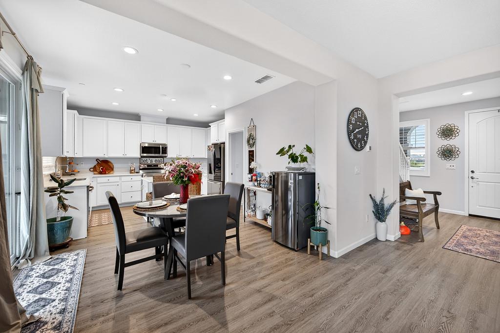 1397 Rio Grande Drive Plumas Lake, CA 95961 - Photo 16 of 54 a view of kitchen with stainless steel appliances granite countertop dining table chairs and a refrigerator