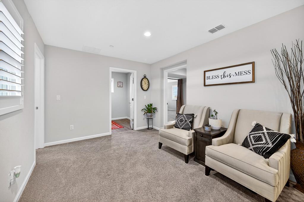 1397 Rio Grande Drive Plumas Lake, CA 95961 - Photo 32 of 54 a living room with furniture and white walls