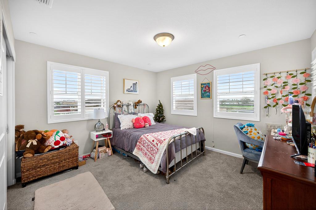 1397 Rio Grande Drive Plumas Lake, CA 95961 - Photo 34 of 54 a bedroom with bed and a window