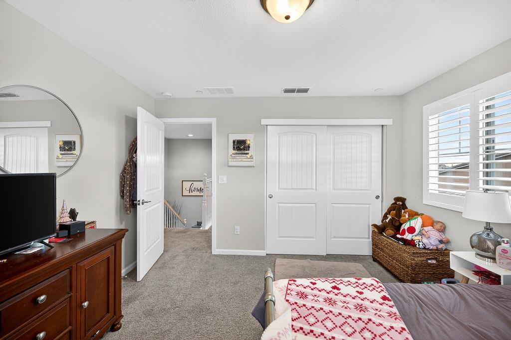 1397 Rio Grande Drive Plumas Lake, CA 95961 - Photo 35 of 54 a living room with furniture and a flat screen tv