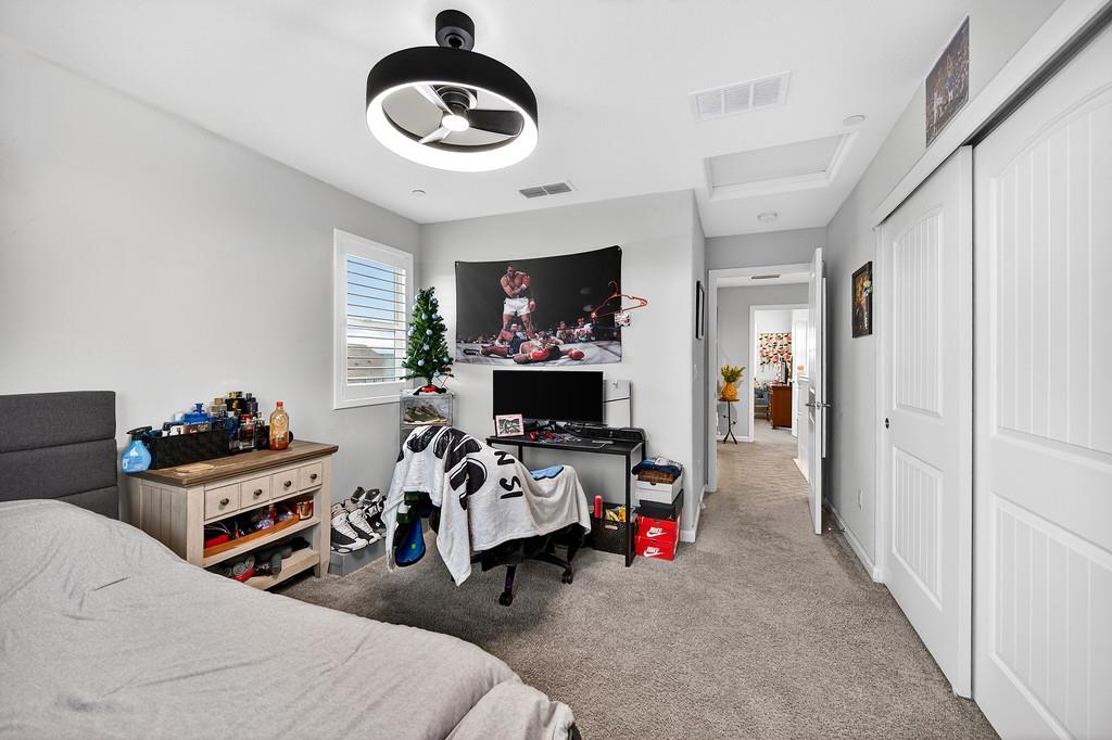 1397 Rio Grande Drive Plumas Lake, CA 95961 - Photo 38 of 54 a bed room with a bed and a chair