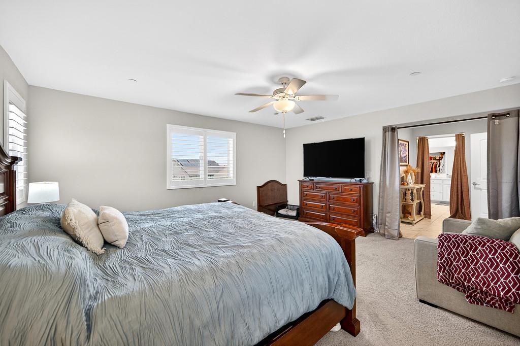 1397 Rio Grande Drive Plumas Lake, CA 95961 - Photo 41 of 54 a bedroom with a bed and a flat screen tv