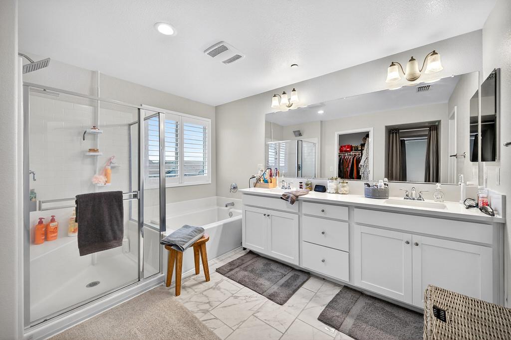 1397 Rio Grande Drive Plumas Lake, CA 95961 - Photo 43 of 54 a bathroom with a double vanity sink mirror and shower