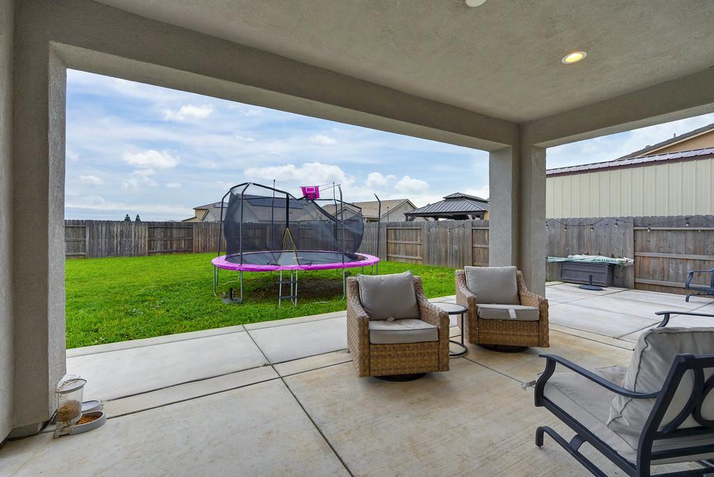 1397 Rio Grande Drive Plumas Lake, CA 95961 - Photo 45 of 54 a bedroom with furniture and a garden
