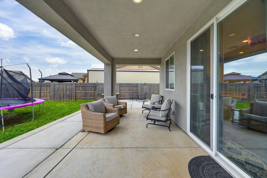 1397 Rio Grande Drive Plumas Lake, CA 95961 - Photo 46 of 54 a living room with furniture and a garden