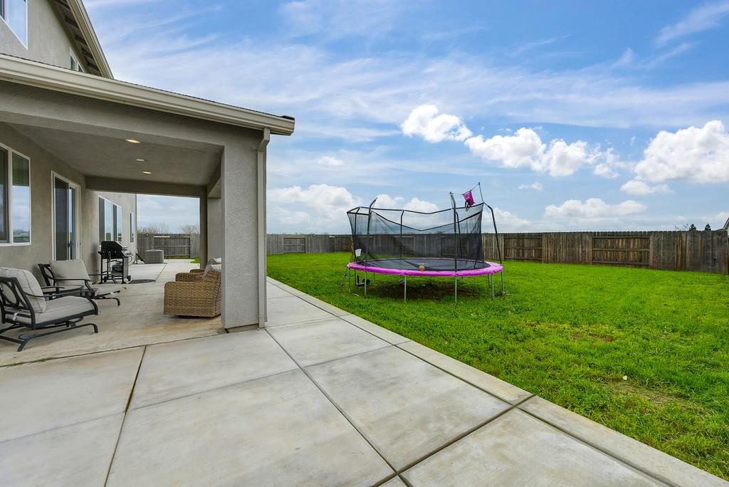 1397 Rio Grande Drive Plumas Lake, CA 95961 - Photo 48 of 54 a view of a patio with a yard