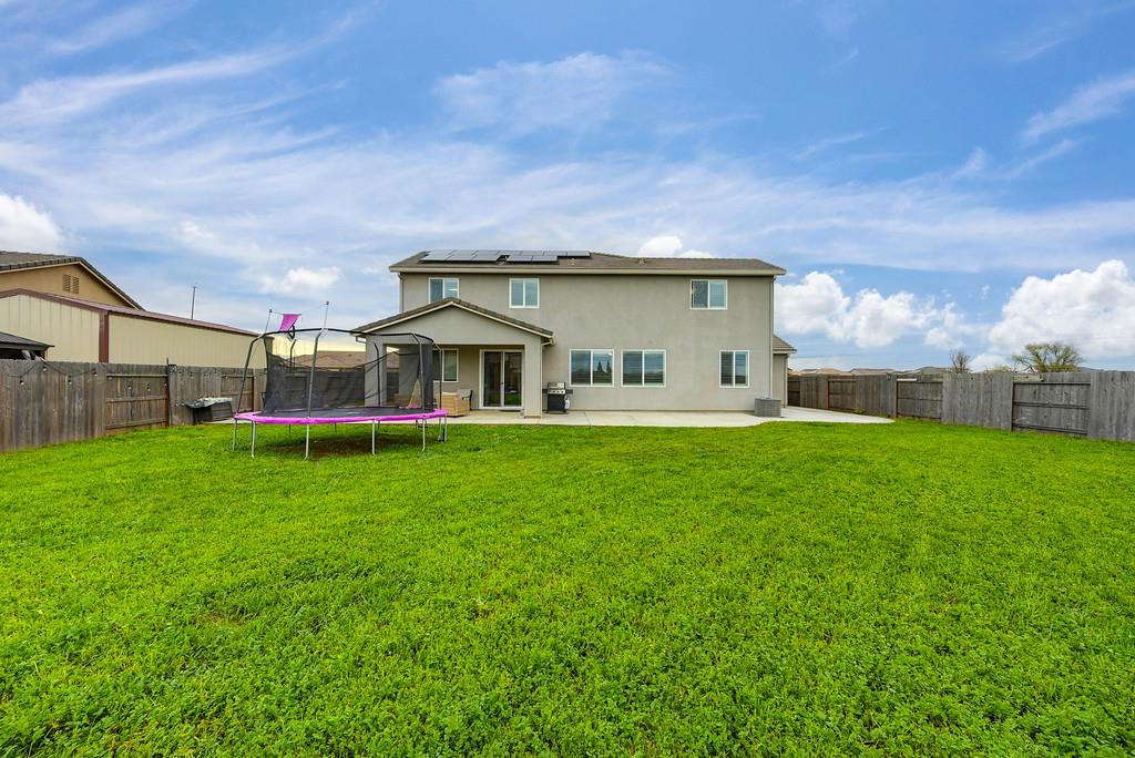 1397 Rio Grande Drive Plumas Lake, CA 95961 - Photo 50 of 54 a front view of house with yard and green space