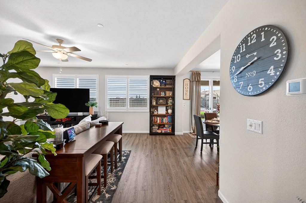 1397 Rio Grande Drive Plumas Lake, CA 95961 - Photo 5 of 54 a living room with furniture a flat screen tv and a fireplace