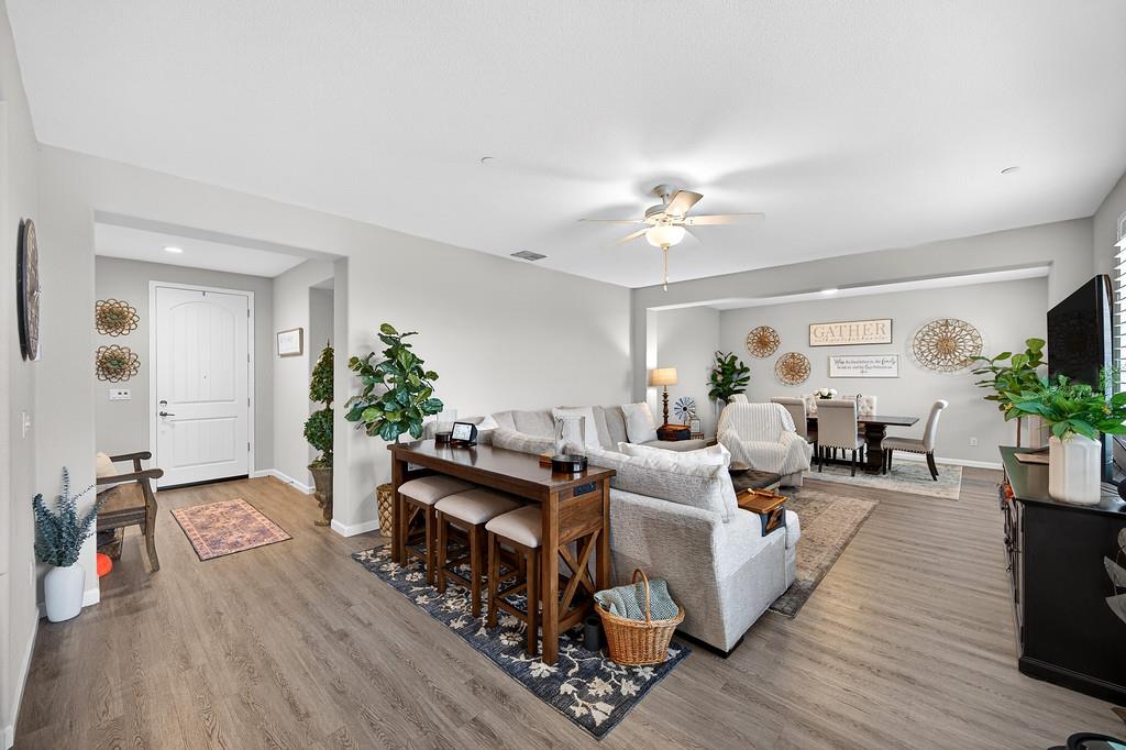 1397 Rio Grande Drive Plumas Lake, CA 95961 - Photo 8 of 54 a living room with furniture and a chandelier