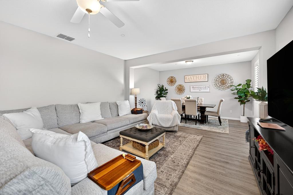 1397 Rio Grande Drive Plumas Lake, CA 95961 - Photo 9 of 54 a living room with furniture a piano and a flat screen tv
