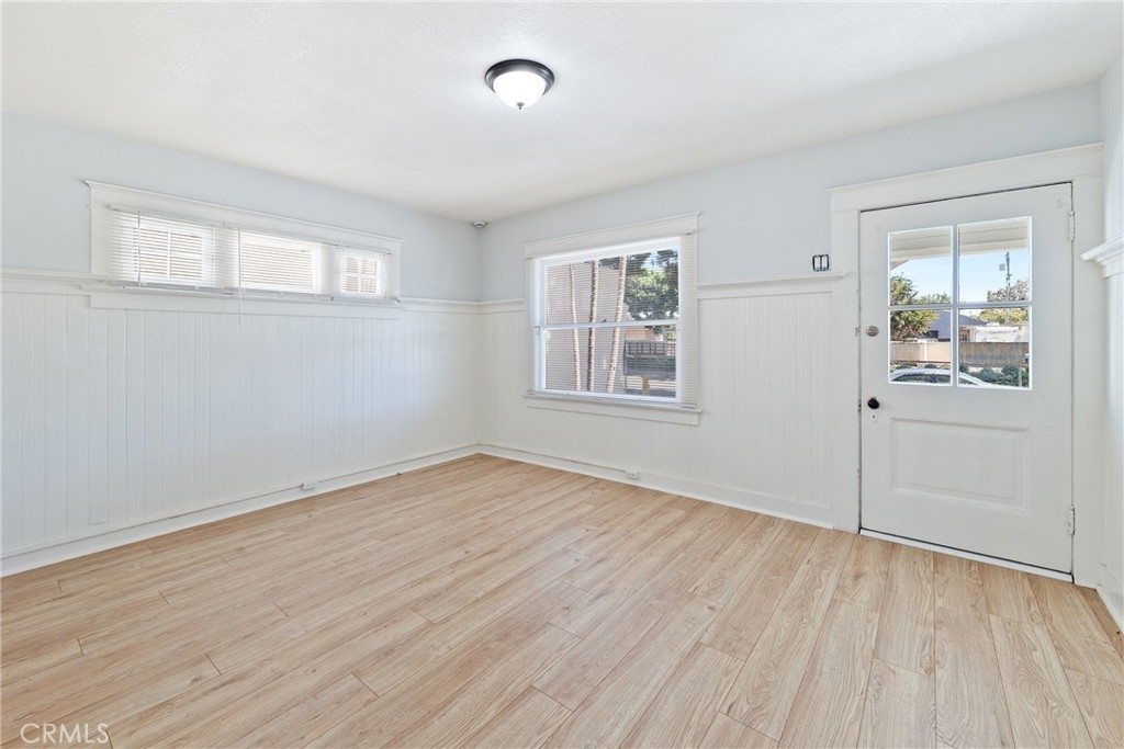 15323 Paramount Boulevard Paramount, CA 90723 - Photo 12 of 72 an empty room with wooden floor and windows
