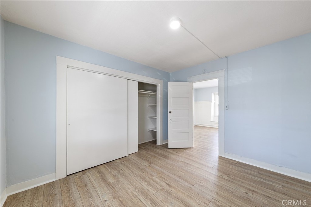 15323 Paramount Boulevard Paramount, CA 90723 - Photo 23 of 72 a view of an empty room with wooden floor