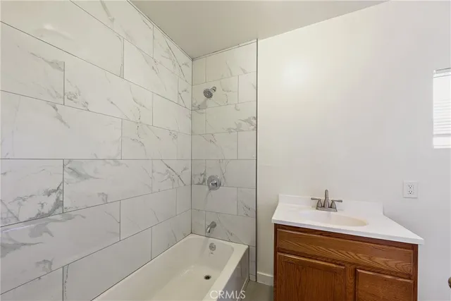 a bathroom with a sink a toilet and bathtub